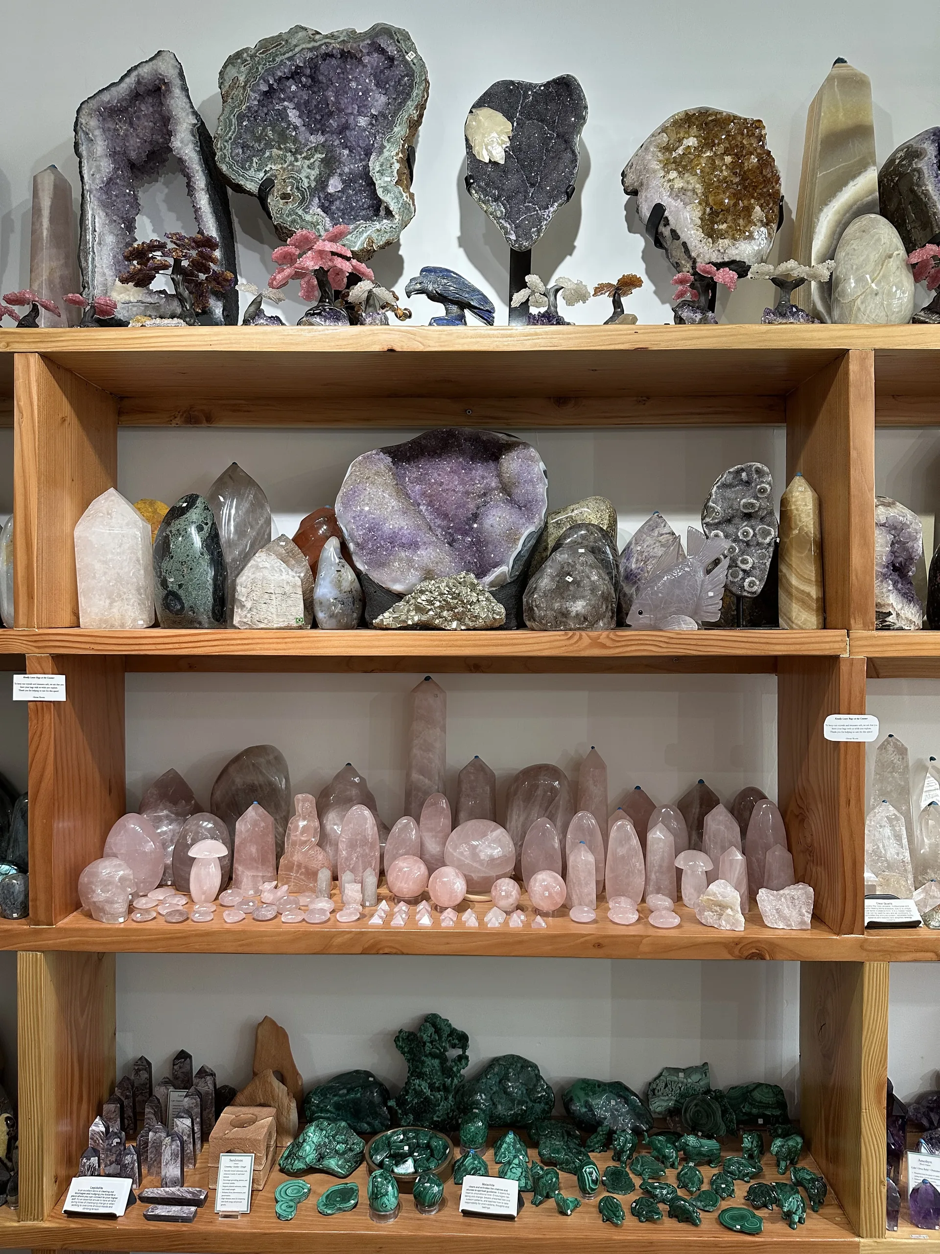 Amethyst geodes, rose quartz and malachite displayed at Stone Room 2 Berkeley